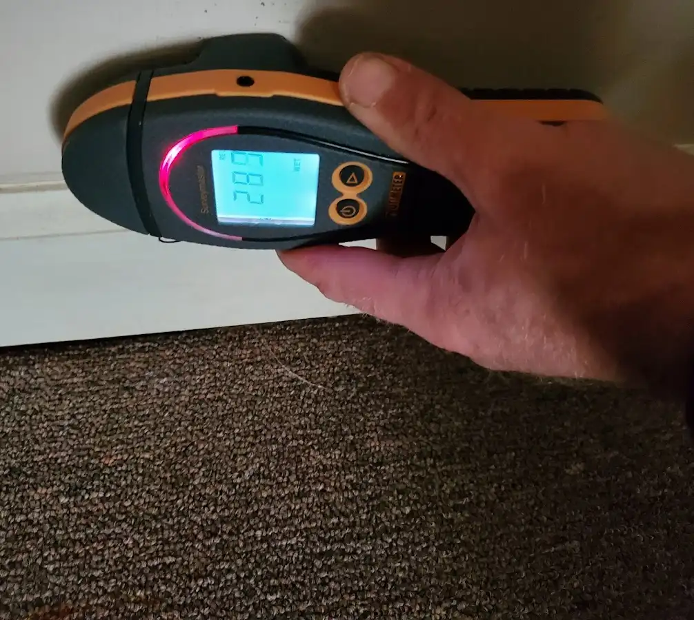 Moisture detection at baseboard during Storm Damage Restoration in Orcutt